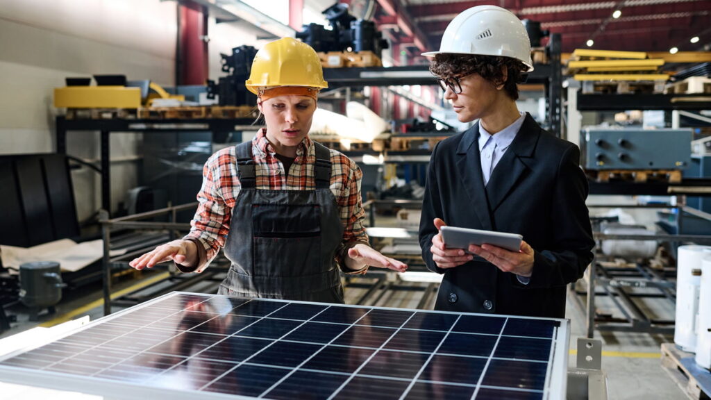 Engineer talking about solar panel to collegue