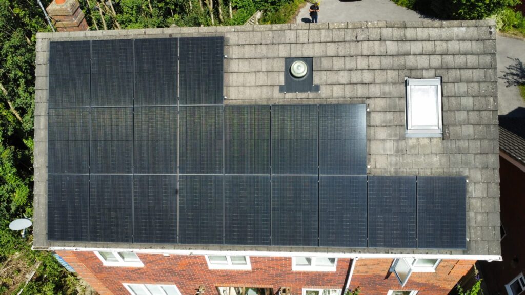 Dorset home with solar panels installed on the roof, capturing sunlight for renewable energy.